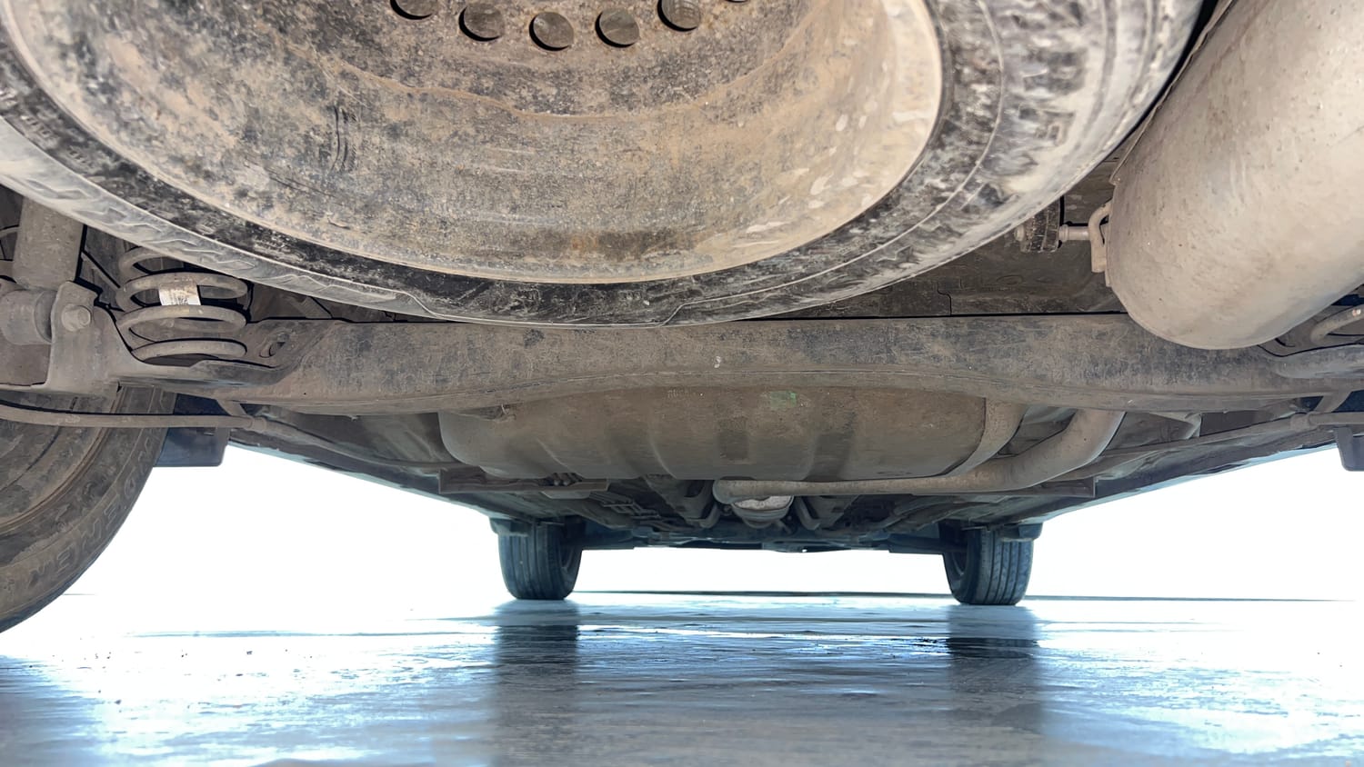 Used 2022 Kia Carens Prestige 1.4 Petrol MT 7 STR Petrol Manual extra REAR UNDERBODY VIEW (TAKEN FROM REAR)