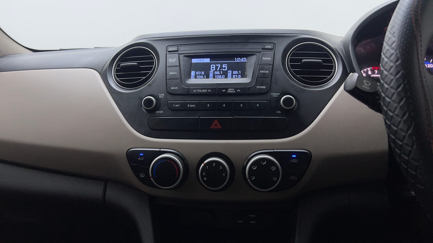 Used 2019 Hyundai Xcent S Petrol+cng(outside fitted) Cng Manual interior MUSIC SYSTEM & AC CONTROL VIEW