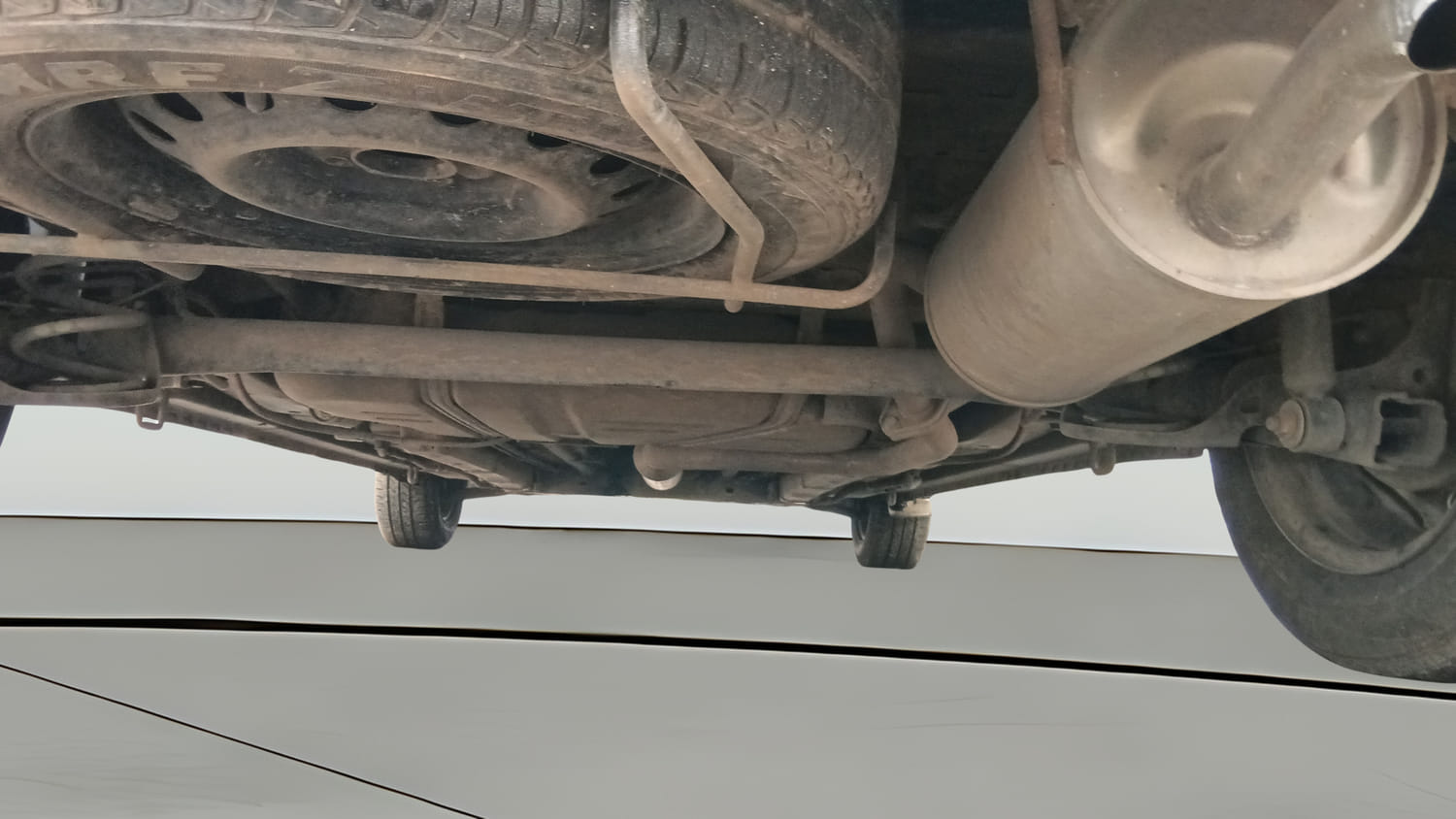 Used 2015 Maruti Suzuki Ertiga Vxi Petrol Manual extra REAR UNDERBODY VIEW (TAKEN FROM REAR)
