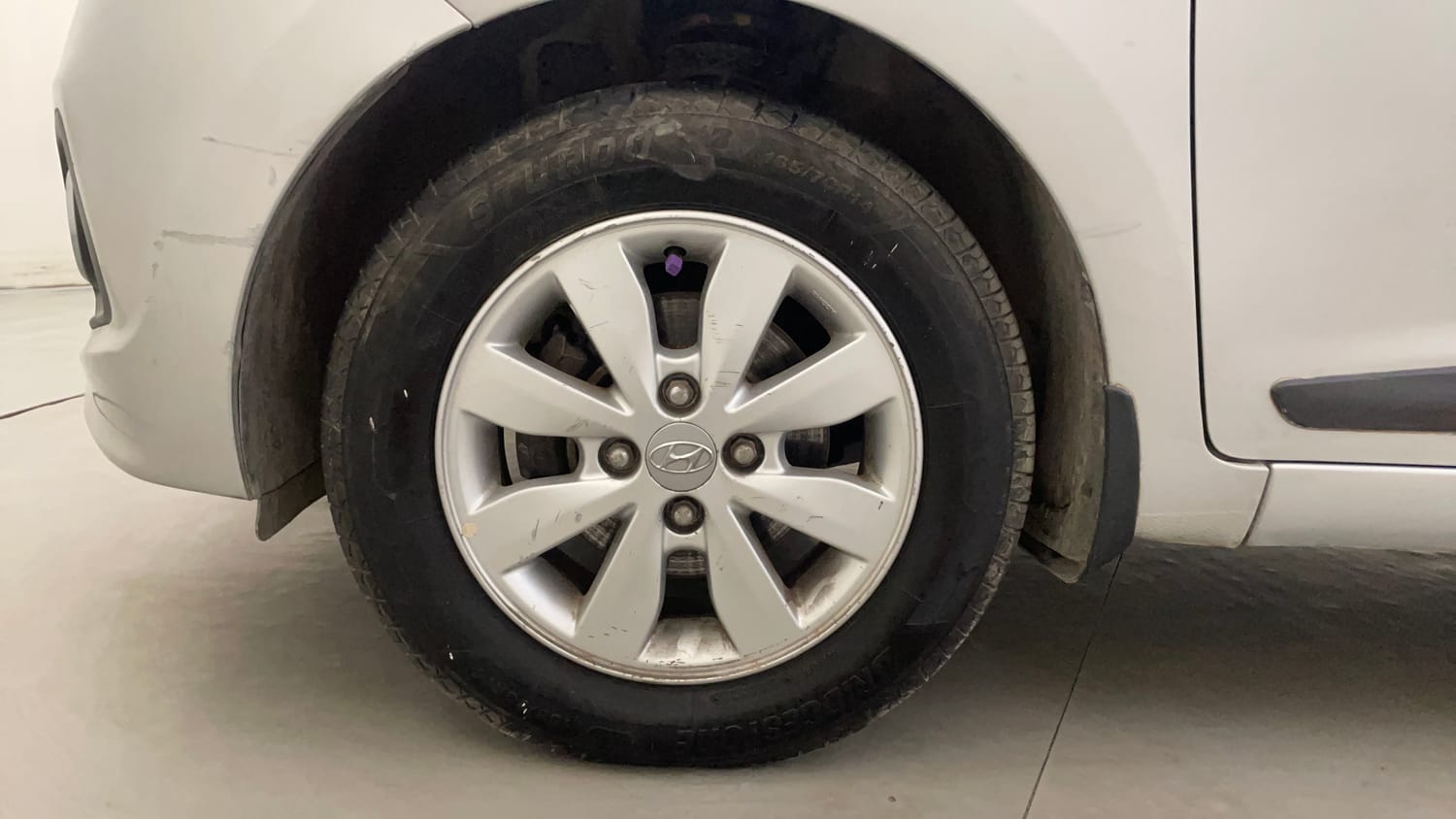 Used 2014 Hyundai Xcent S 1.2 (O) Petrol Manual tyres LEFT FRONT TYRE RIM VIEW