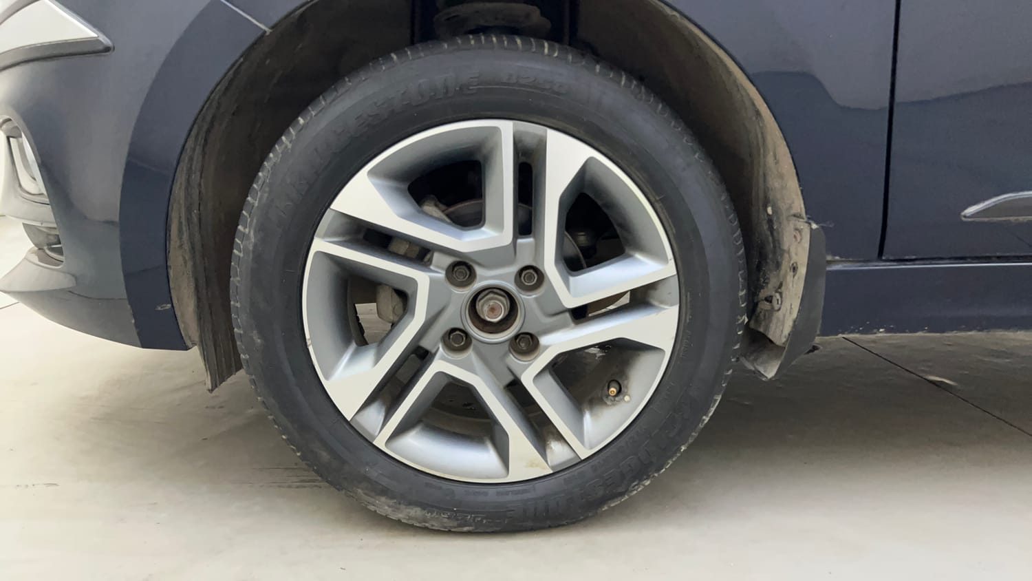 Used 2022 Tata Tigor XZA Plus Petrol Automatic tyres LEFT FRONT TYRE RIM VIEW