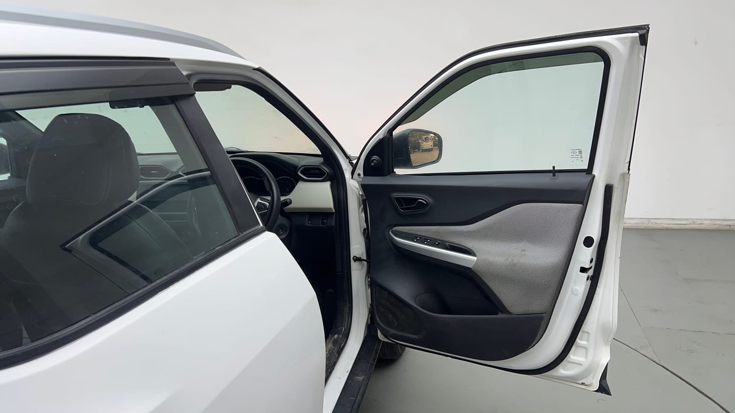 Used 2023 Nissan Magnite XE Petrol Manual interior RIGHT FRONT DOOR OPEN VIEW