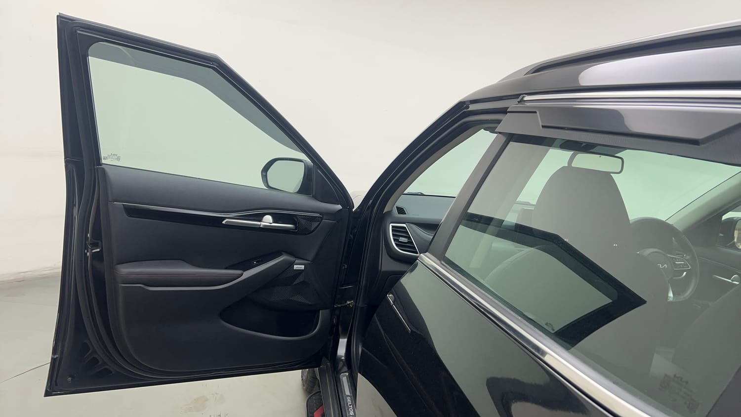 Used 2023 Kia Seltos GTX Plus 1.4 Petrol Manual interior LEFT FRONT DOOR OPEN VIEW