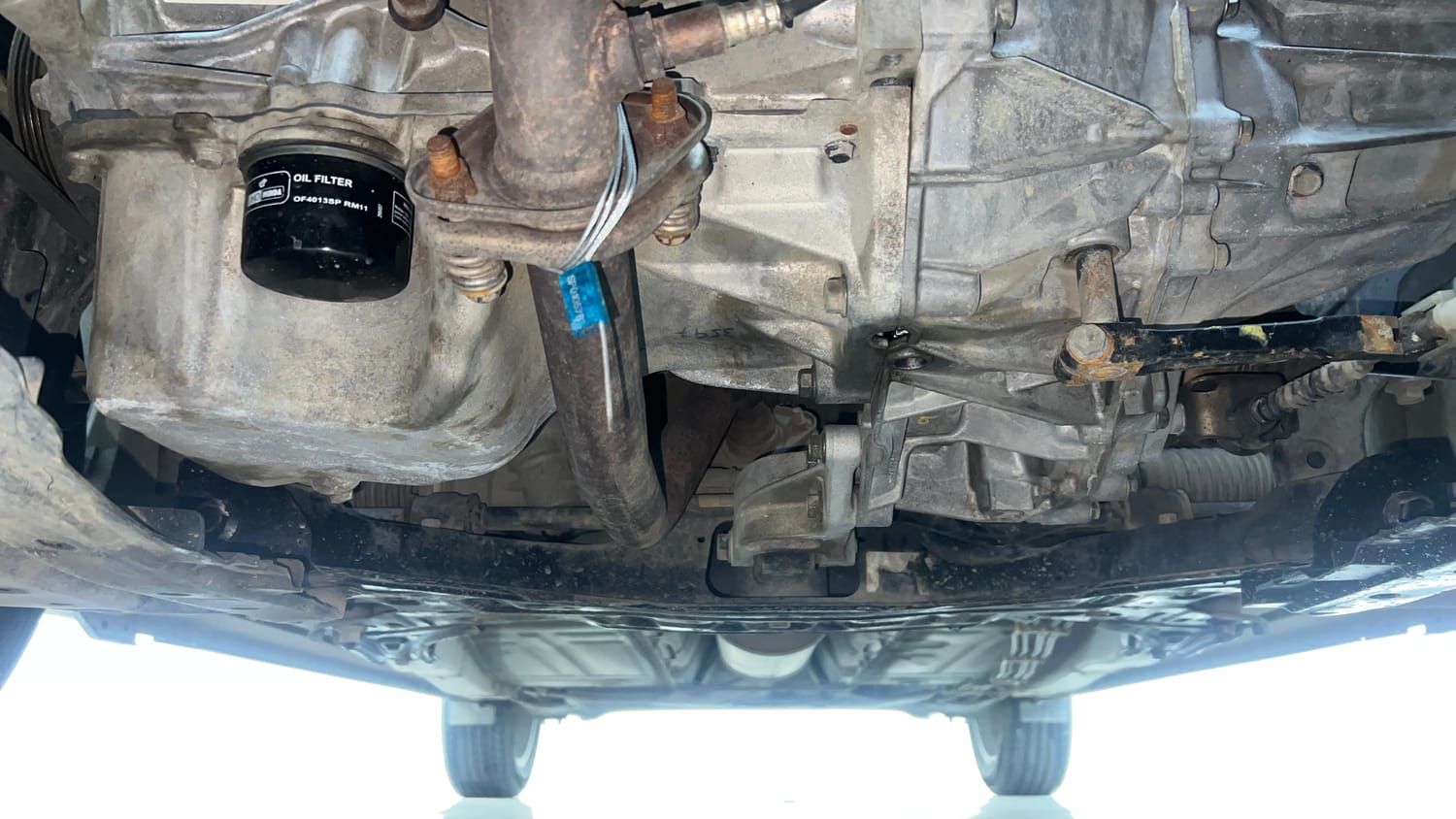 Used 2015 Maruti Suzuki Baleno Zeta 1.2 Petrol Manual extra FRONT LEFT UNDERBODY VIEW