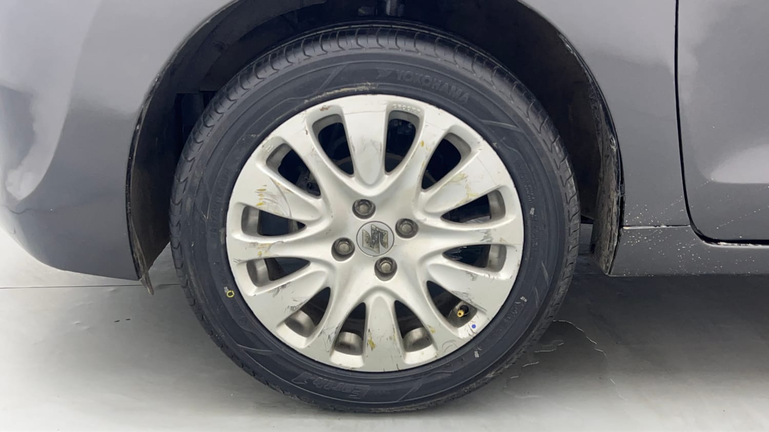 Used 2015 Maruti Suzuki Baleno Zeta 1.2 Petrol Manual tyres LEFT FRONT TYRE RIM VIEW