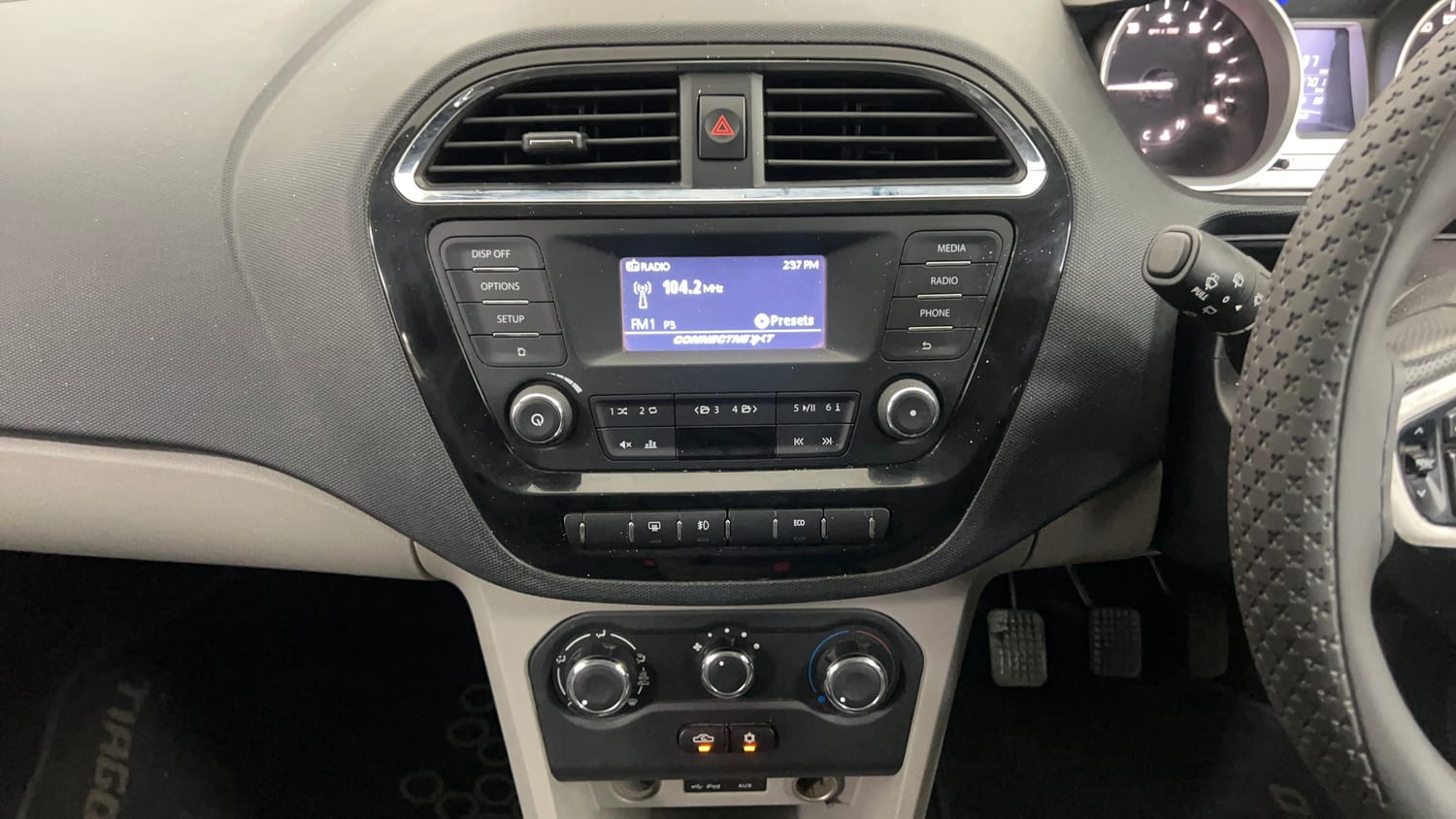 Used 2016 Tata Tiago Revotron XZ Petrol Manual interior MUSIC SYSTEM & AC CONTROL VIEW