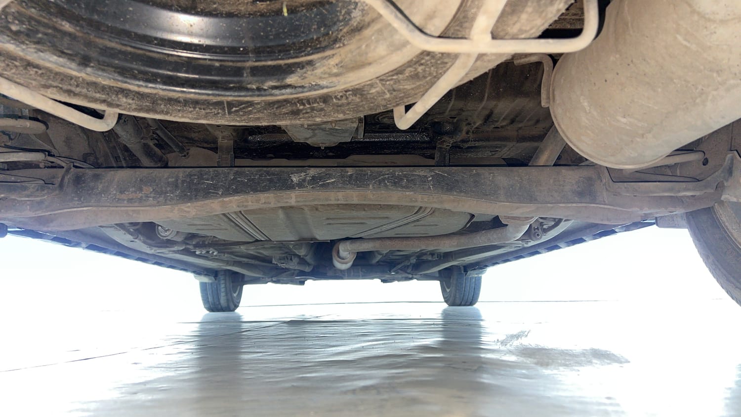 Used 2022 Maruti Suzuki XL6 Zeta AT Petrol Petrol Automatic extra REAR UNDERBODY VIEW (TAKEN FROM REAR)