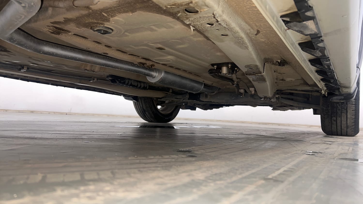 Used 2023 Maruti Suzuki XL6 Zeta AT Petrol Petrol Automatic extra REAR RIGHT UNDERBODY VIEW