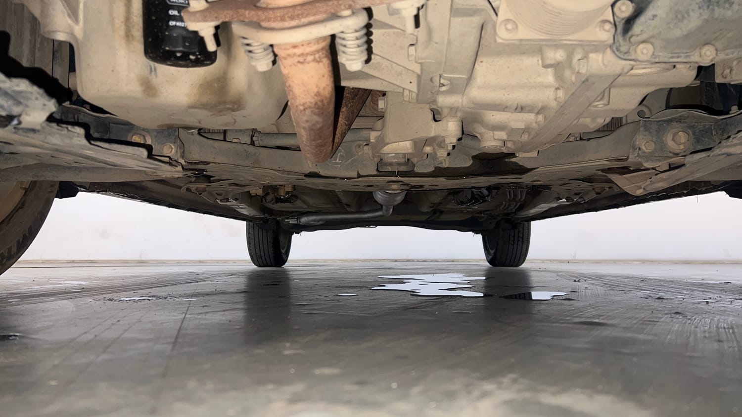 Used 2023 Maruti Suzuki XL6 Zeta AT Petrol Petrol Automatic extra FRONT LEFT UNDERBODY VIEW