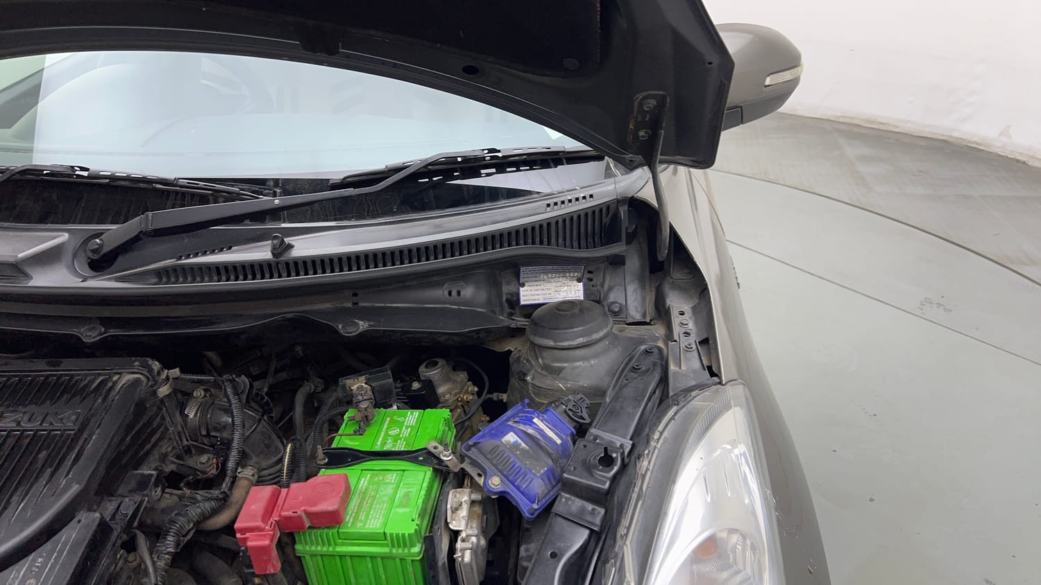 Used 2016 Maruti Suzuki Swift Dzire VXI Petrol + CNG (Outside Fitted) Cng Manual engine ENGINE LEFT SIDE HINGE & APRON VIEW