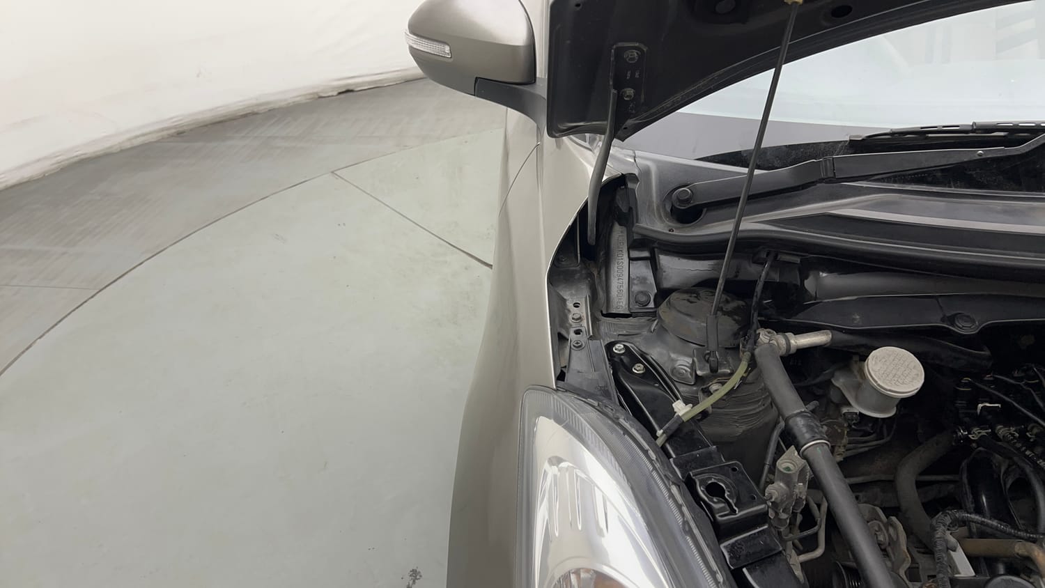Used 2016 Maruti Suzuki Swift Dzire VXI Petrol + CNG (Outside Fitted) Cng Manual engine ENGINE RIGHT SIDE HINGE & APRON VIEW