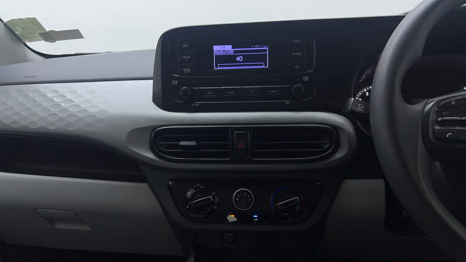 Used 2021 Hyundai Grand i10 Nios Magna 1.2 Kappa VTVT Petrol Manual interior MUSIC SYSTEM & AC CONTROL VIEW