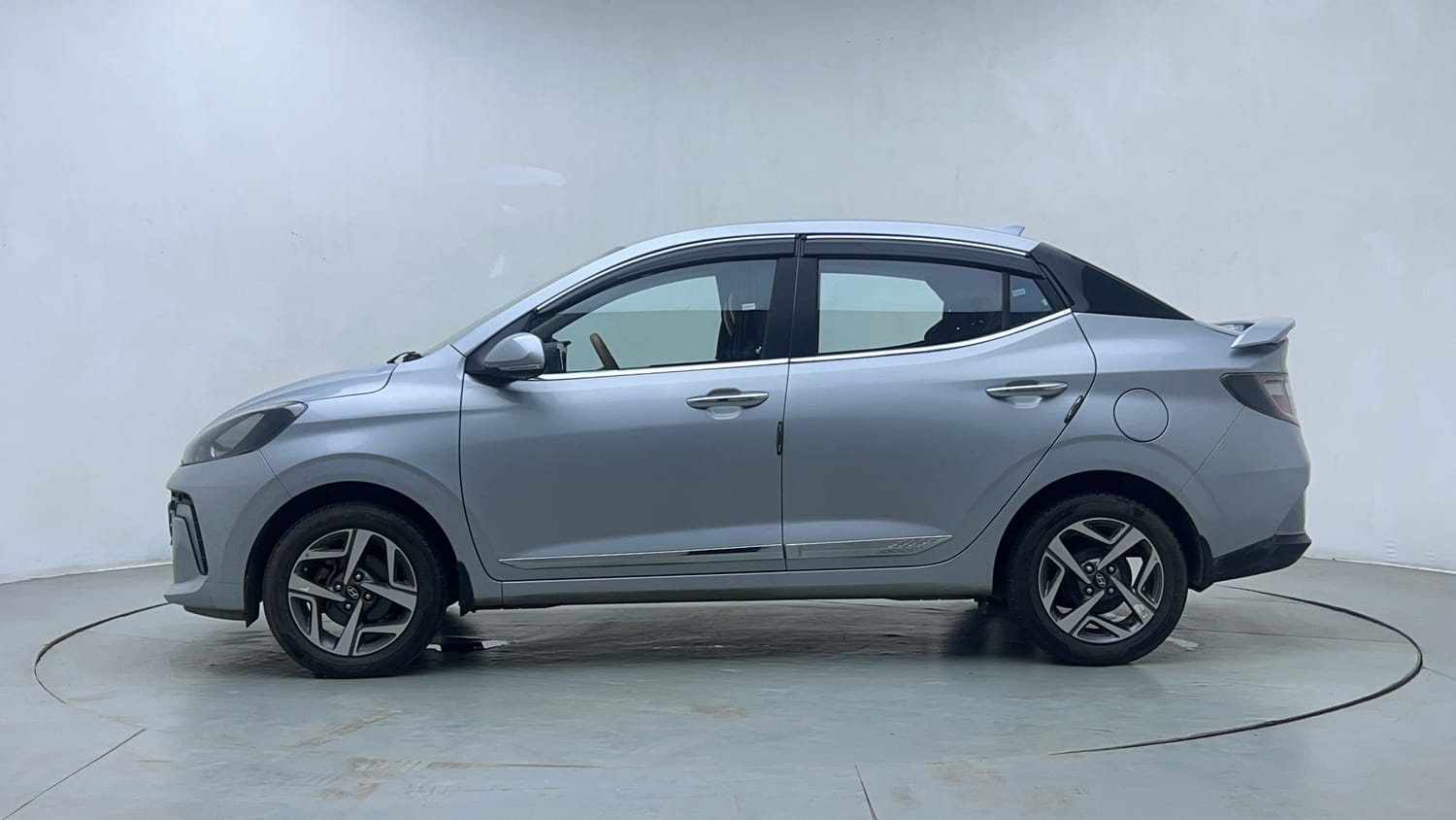 Used 2024 Hyundai Aura SX 1.2 CNG Cng Manual exterior LEFT SIDE VIEW