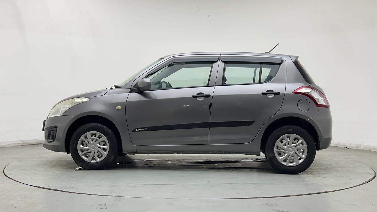 Used 2016 Maruti Suzuki Swift Lxi (O) Petrol Manual exterior LEFT SIDE VIEW