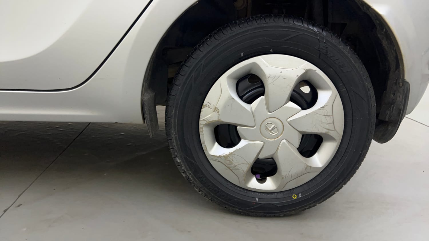 Used 2016 Tata Tiago Revotron XT Petrol Manual tyres LEFT REAR TYRE RIM VIEW