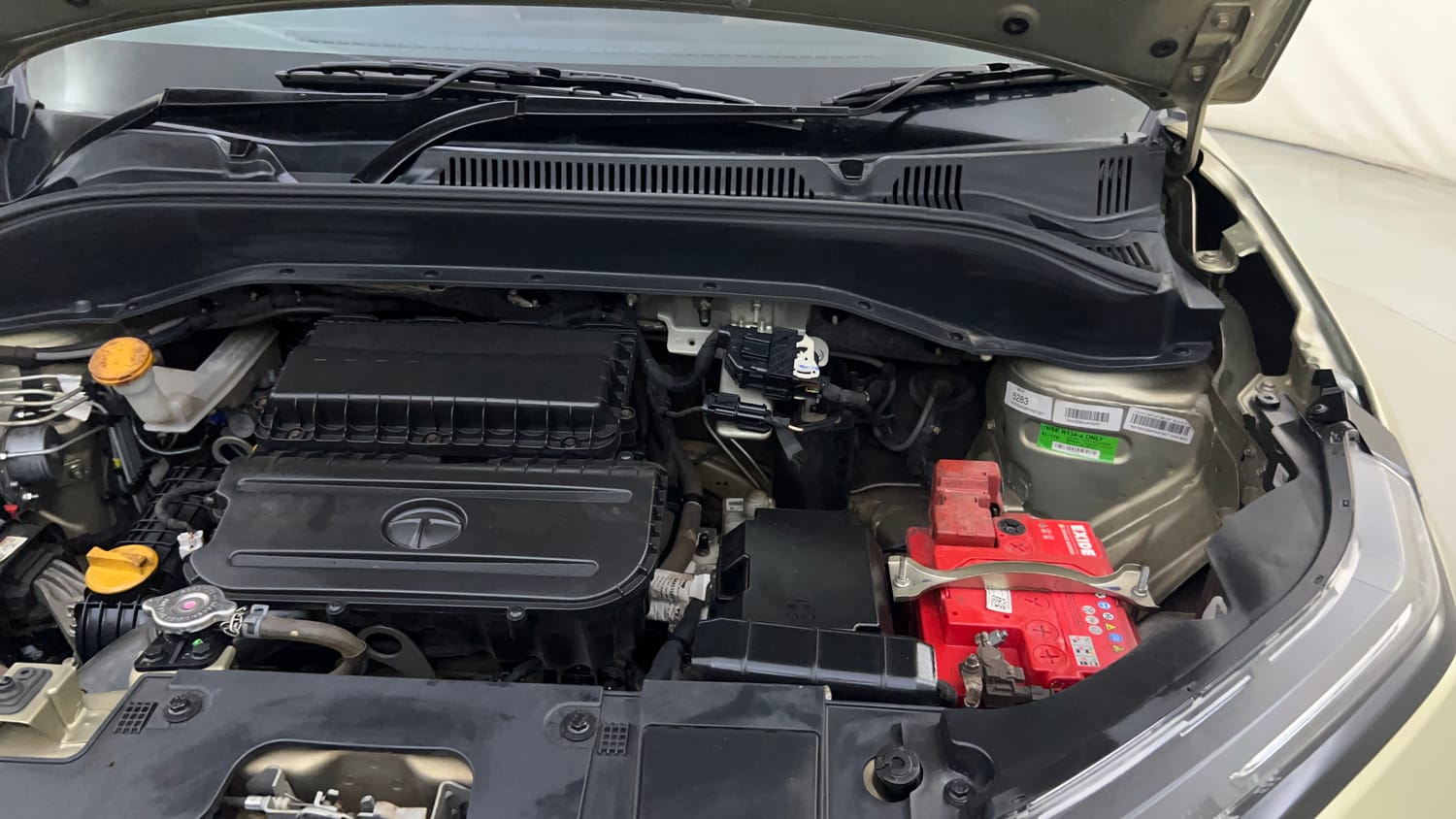 Used 2023 Tata Punch Kaziranga Creative iRA Pack AMT Petrol Automatic engine ENGINE LEFT SIDE HINGE & APRON VIEW