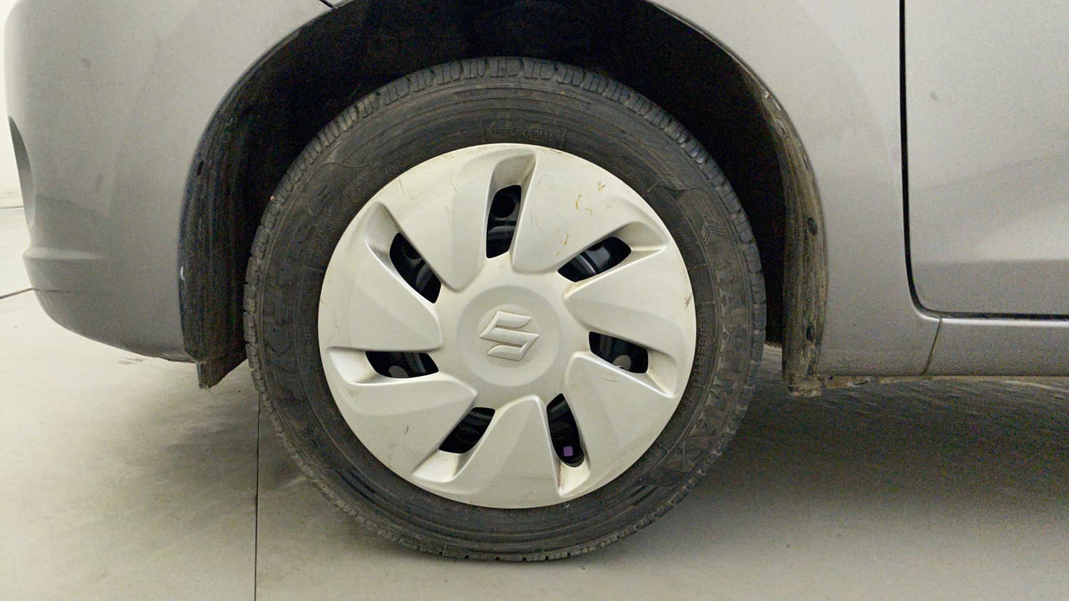 Used 2015 Maruti Suzuki Celerio ZXi Petrol Manual tyres LEFT FRONT TYRE RIM VIEW