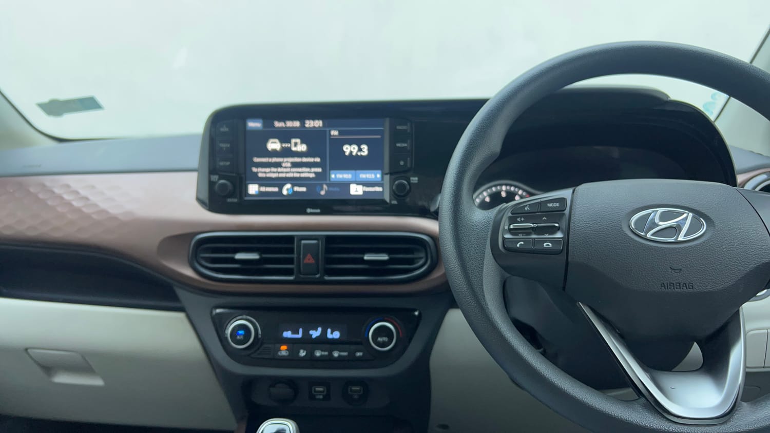 Used 2021 Hyundai Aura SX Plus 1.2 AMT Petrol Petrol Automatic interior MUSIC SYSTEM & AC CONTROL VIEW