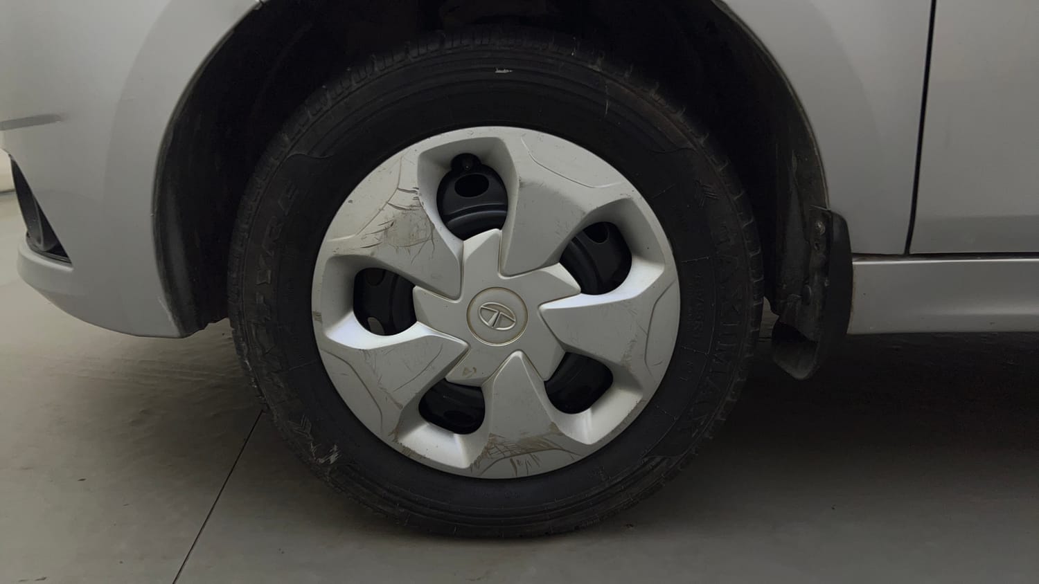 Used 2016 Tata Tiago Revotron XT Petrol Manual tyres LEFT FRONT TYRE RIM VIEW