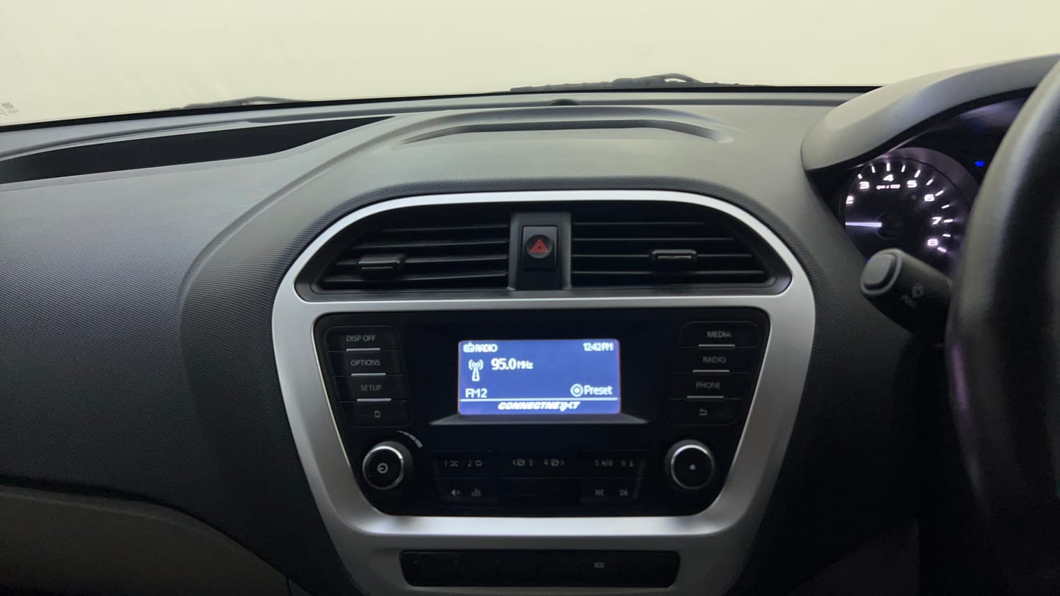 Used 2016 Tata Tiago Revotron XT Petrol Manual top_features Integrated (in-dash) music system