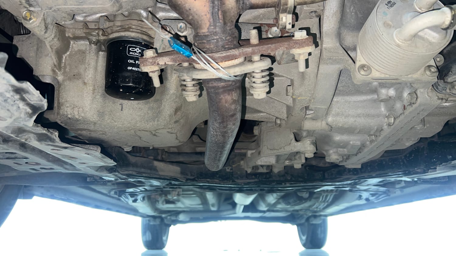 Used 2022 Maruti Suzuki XL6 Alpha Plus AT Petrol Petrol Automatic extra FRONT LEFT UNDERBODY VIEW