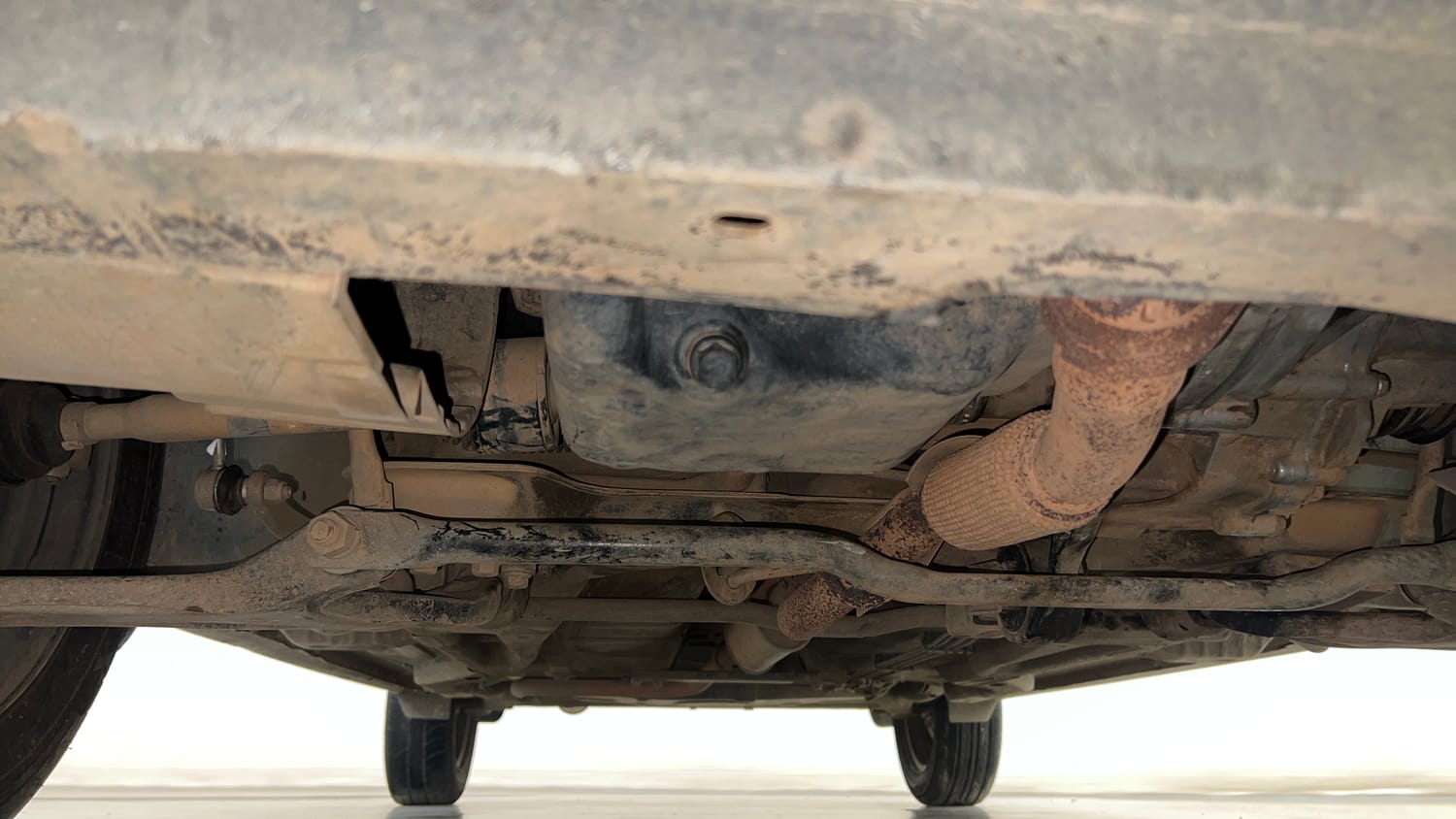 Used 2016 Tata Tiago Revotron XT Petrol Manual extra FRONT LEFT UNDERBODY VIEW