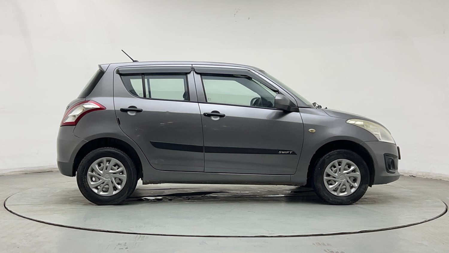 Used 2016 Maruti Suzuki Swift Lxi (O) Petrol Manual exterior RIGHT SIDE VIEW