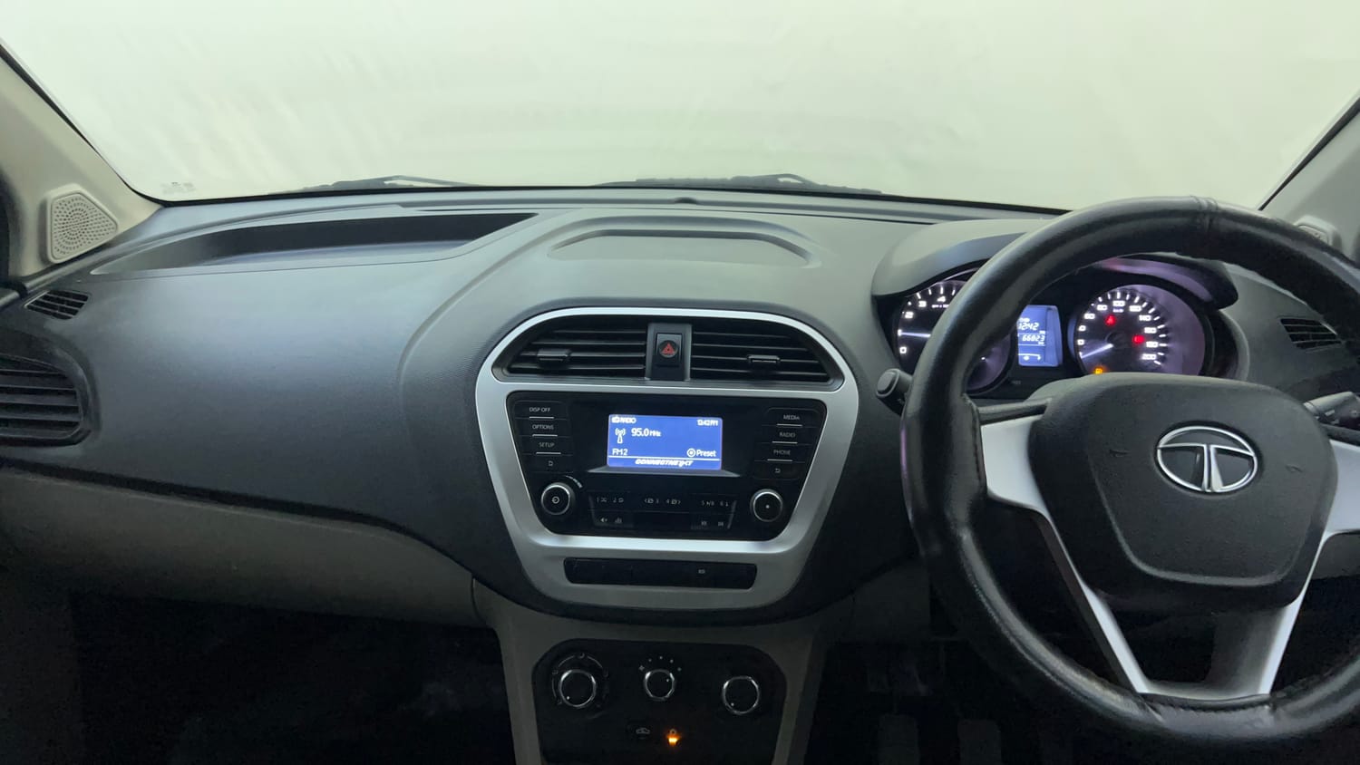 Used 2016 Tata Tiago Revotron XT Petrol Manual interior MUSIC SYSTEM & AC CONTROL VIEW
