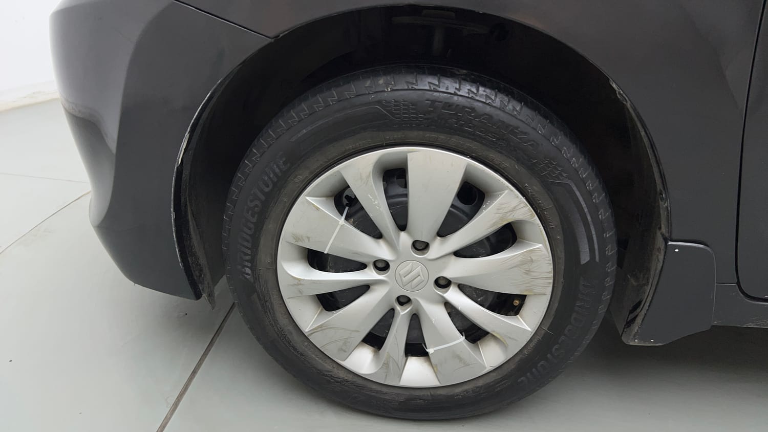 Used 2017 Maruti Suzuki Baleno Delta 1.2 Petrol Manual tyres LEFT FRONT TYRE RIM VIEW