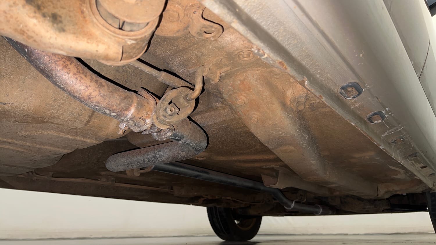 Used 2015 Tata Zest XE Petrol Petrol Manual extra REAR RIGHT UNDERBODY VIEW