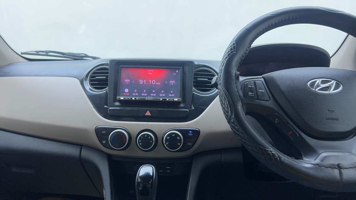 Used 2017 Hyundai Grand i10 Asta AT 1.2 Kappa VTVT (O) Petrol Automatic interior MUSIC SYSTEM & AC CONTROL VIEW