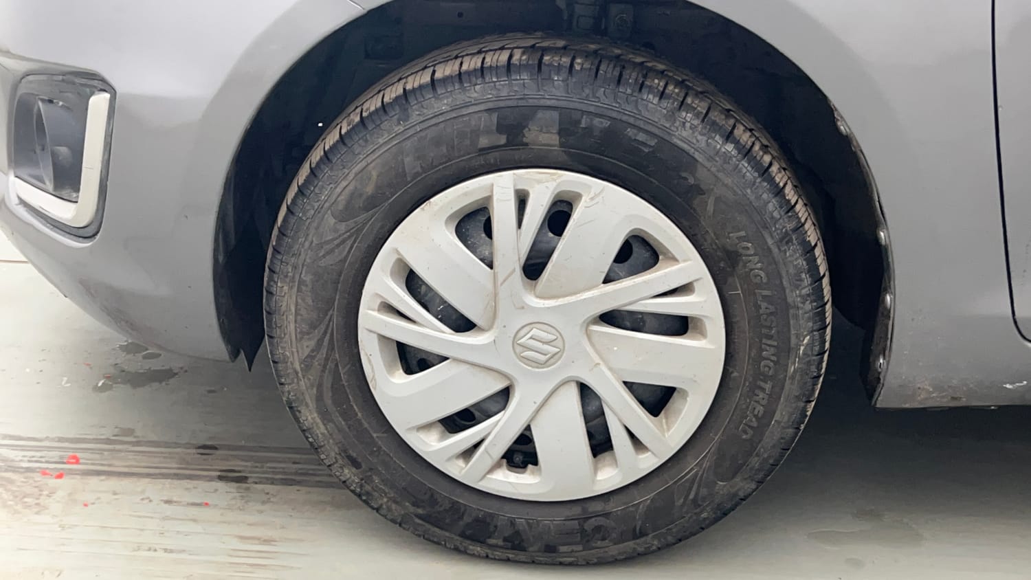 Used 2015 Maruti Suzuki Swift VXi Petrol Manual tyres LEFT FRONT TYRE RIM VIEW