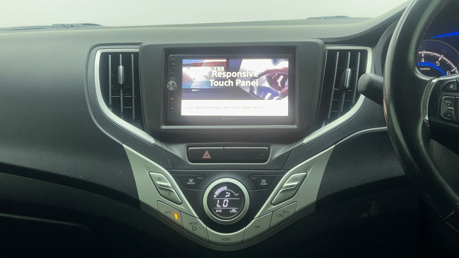 Used 2018 Maruti Suzuki Baleno Zeta 1.2 Petrol Manual top_features Integrated (in-dash) music system