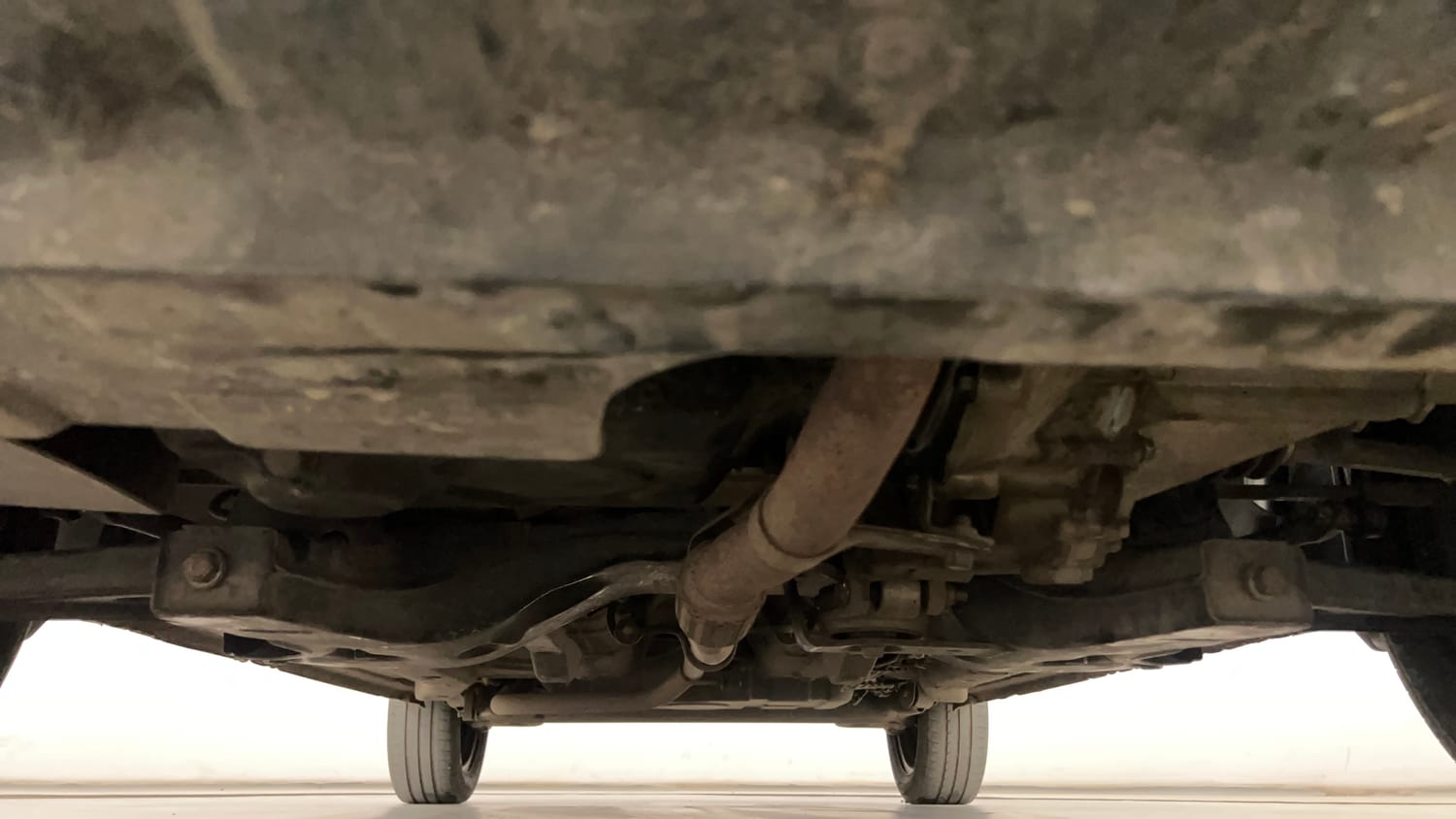 Used 2015 Tata Zest XMS Petrol Petrol Manual extra FRONT LEFT UNDERBODY VIEW