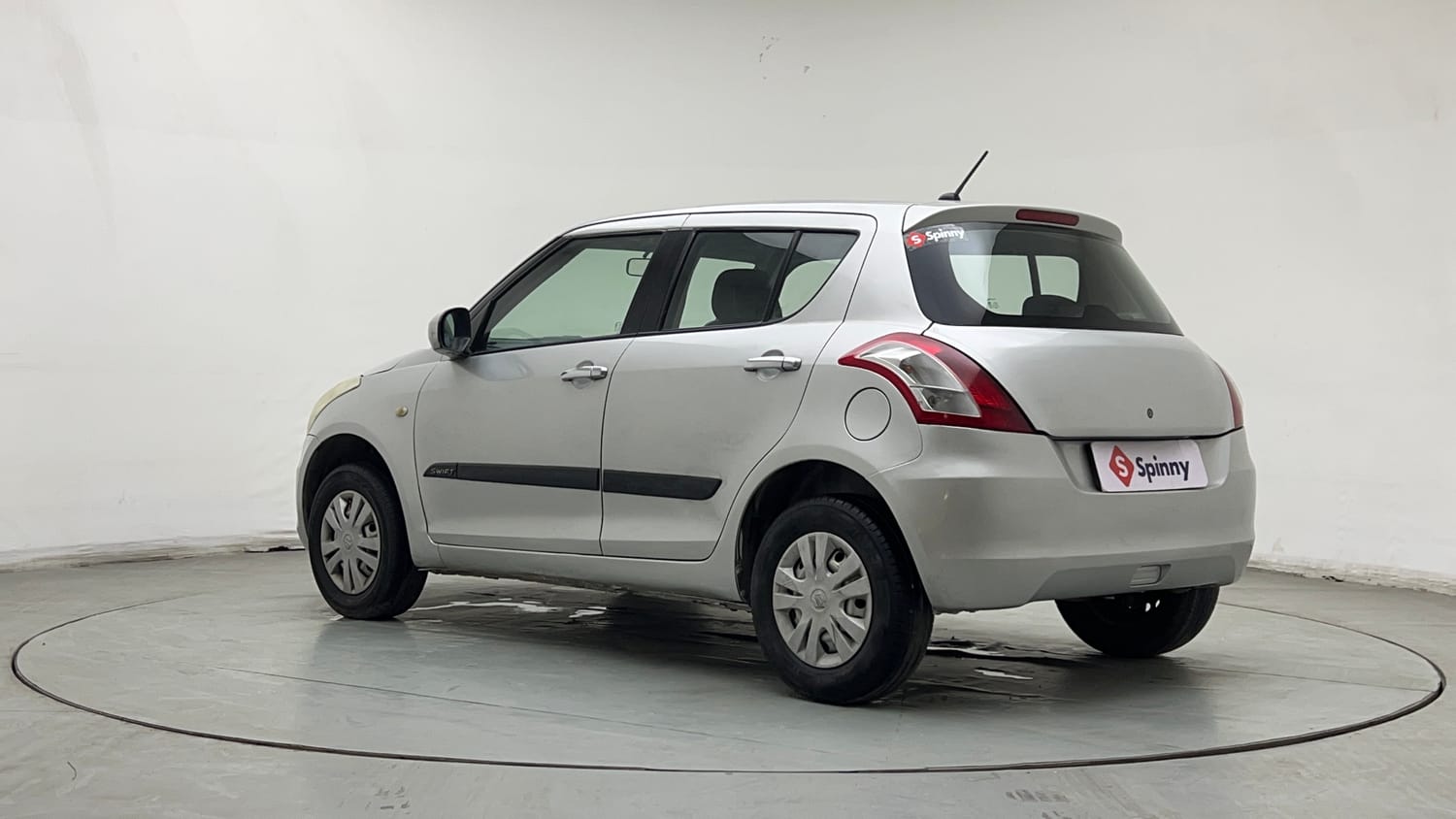 Used 2017 Maruti Suzuki Swift Lxi (O) Petrol Manual exterior LEFT REAR CORNER VIEW