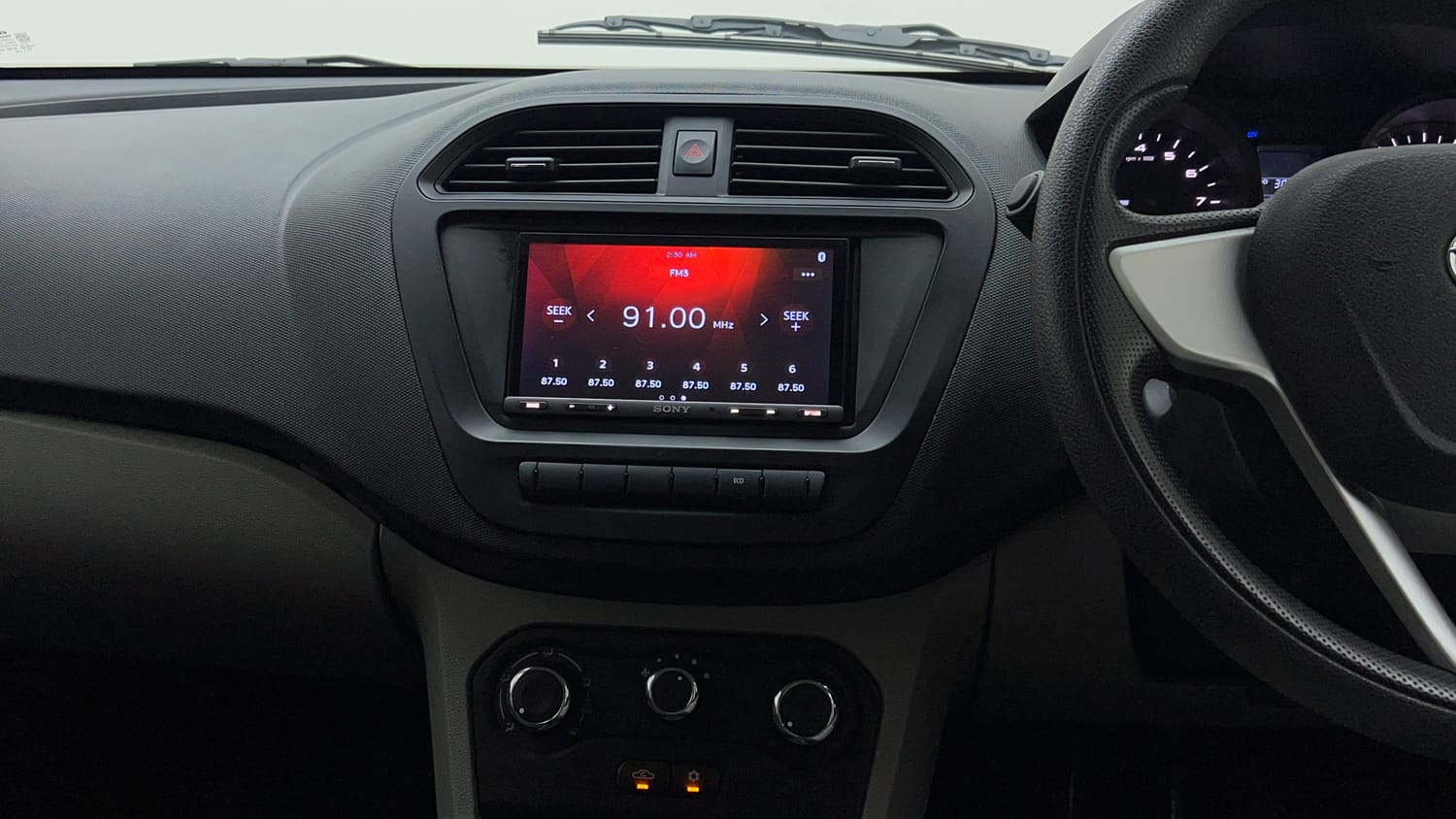 Used 2019 Tata Tiago Revotron XE Petrol Manual interior MUSIC SYSTEM & AC CONTROL VIEW