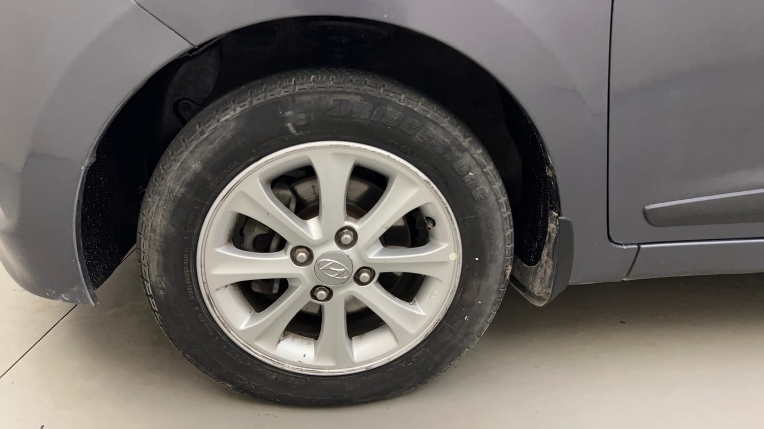 Used 2014 Hyundai Grand i10 Asta 1.2 Kappa VTVT Petrol Manual tyres LEFT FRONT TYRE RIM VIEW