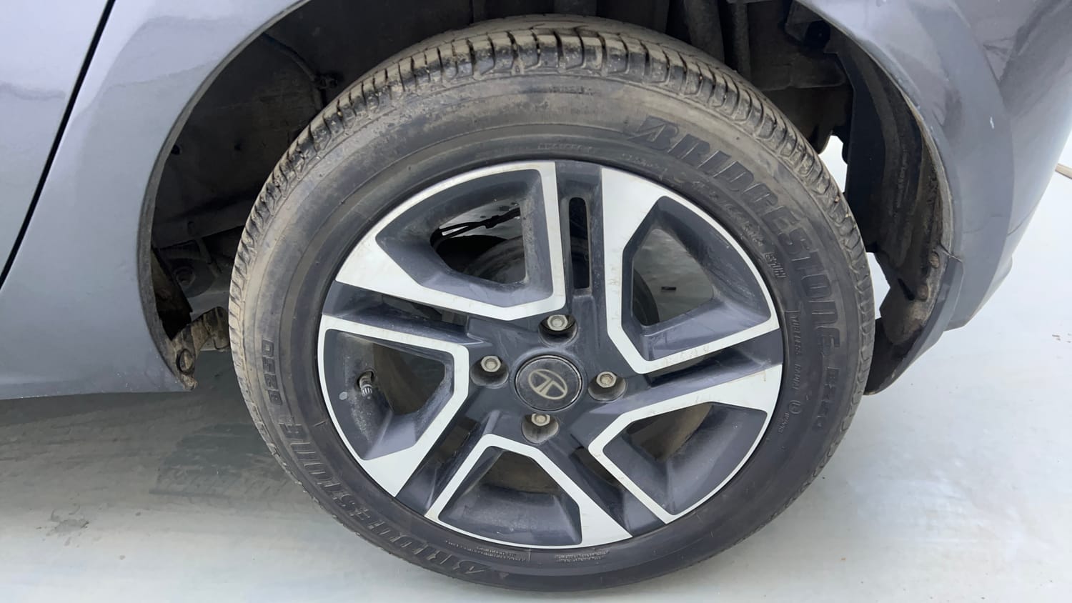 Used 2024 Tata Tiago XZ Plus Petrol Manual tyres LEFT REAR TYRE RIM VIEW