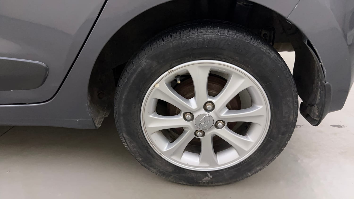 Used 2014 Hyundai Grand i10 Asta 1.2 Kappa VTVT Petrol Manual tyres LEFT REAR TYRE RIM VIEW