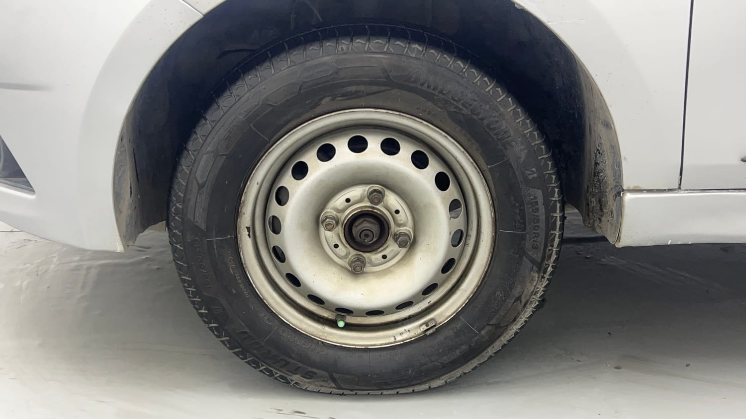 Used 2019 Tata Tiago Revotron XE Petrol Manual tyres LEFT FRONT TYRE RIM VIEW