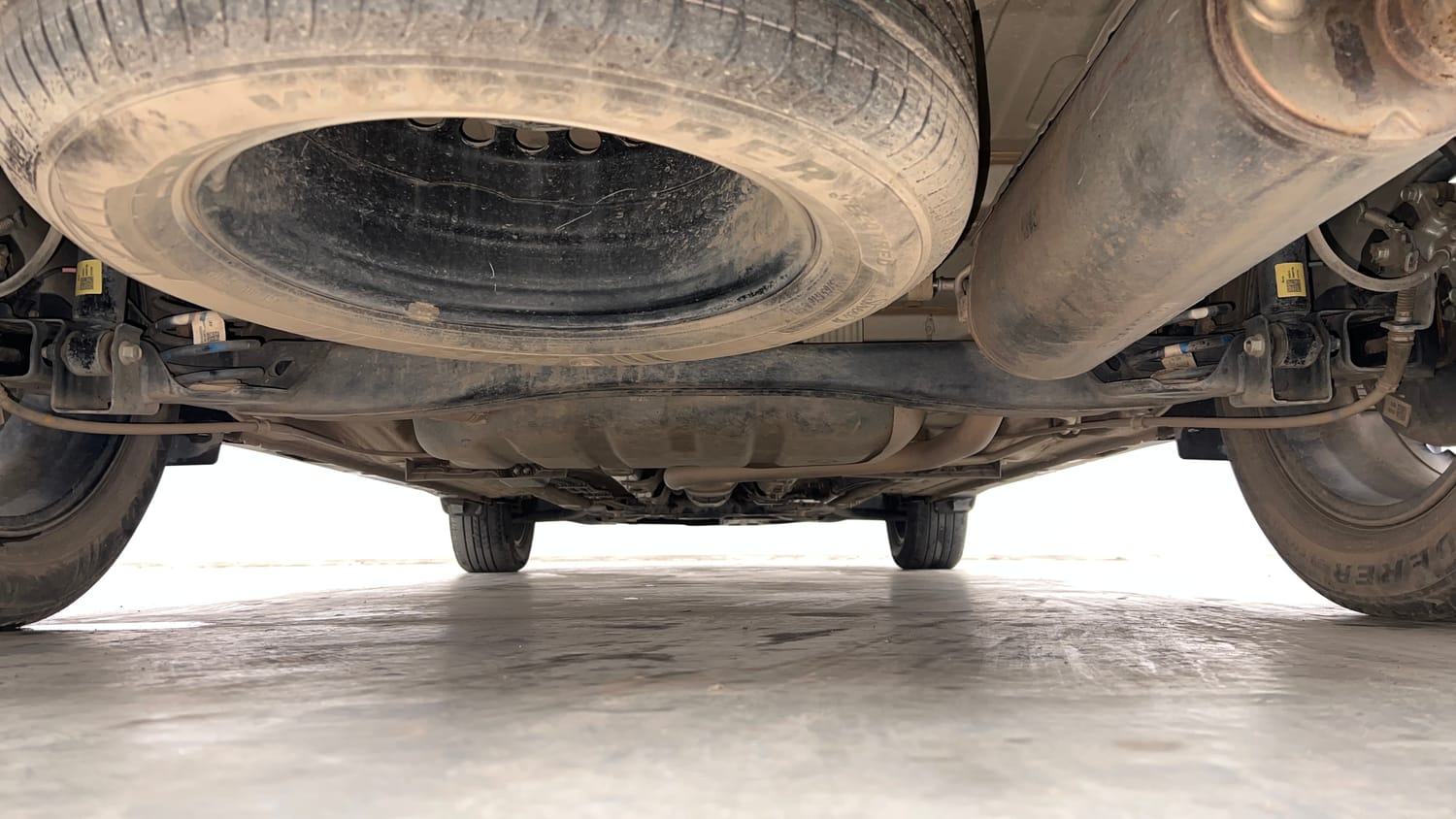 Used 2023 Kia Carens Luxury (O)1.5 Turbo Petrol DCT 7 STR Petrol Automatic extra REAR UNDERBODY VIEW (TAKEN FROM REAR)