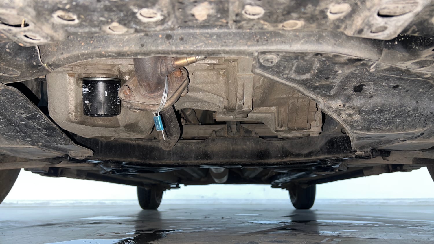 Used 2015 Maruti Suzuki Swift Lxi (O) Petrol Manual extra FRONT LEFT UNDERBODY VIEW