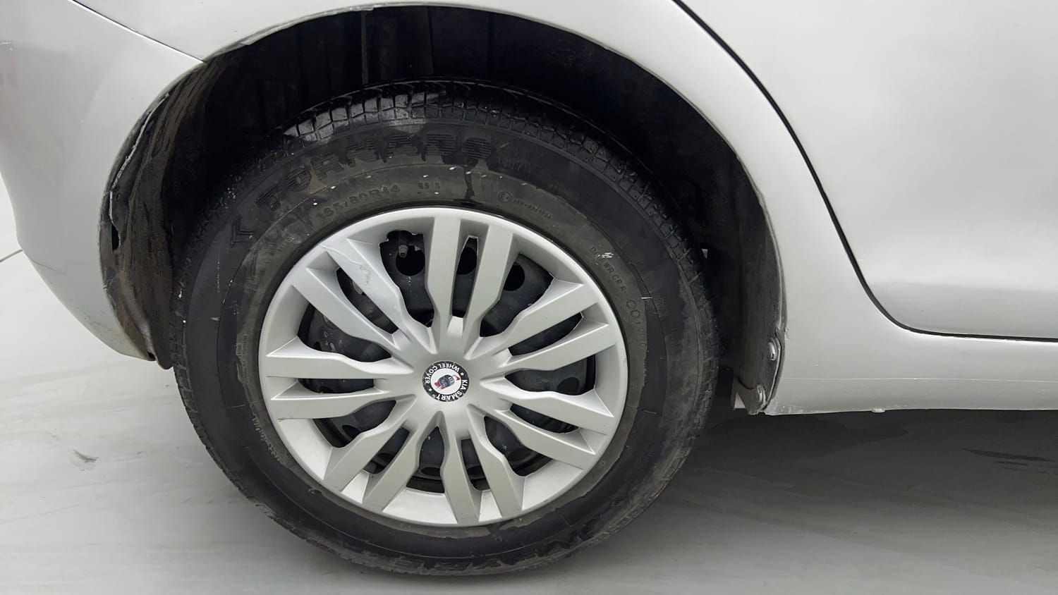 Used 2015 Maruti Suzuki Swift Lxi (O) Petrol Manual tyres RIGHT REAR TYRE RIM VIEW