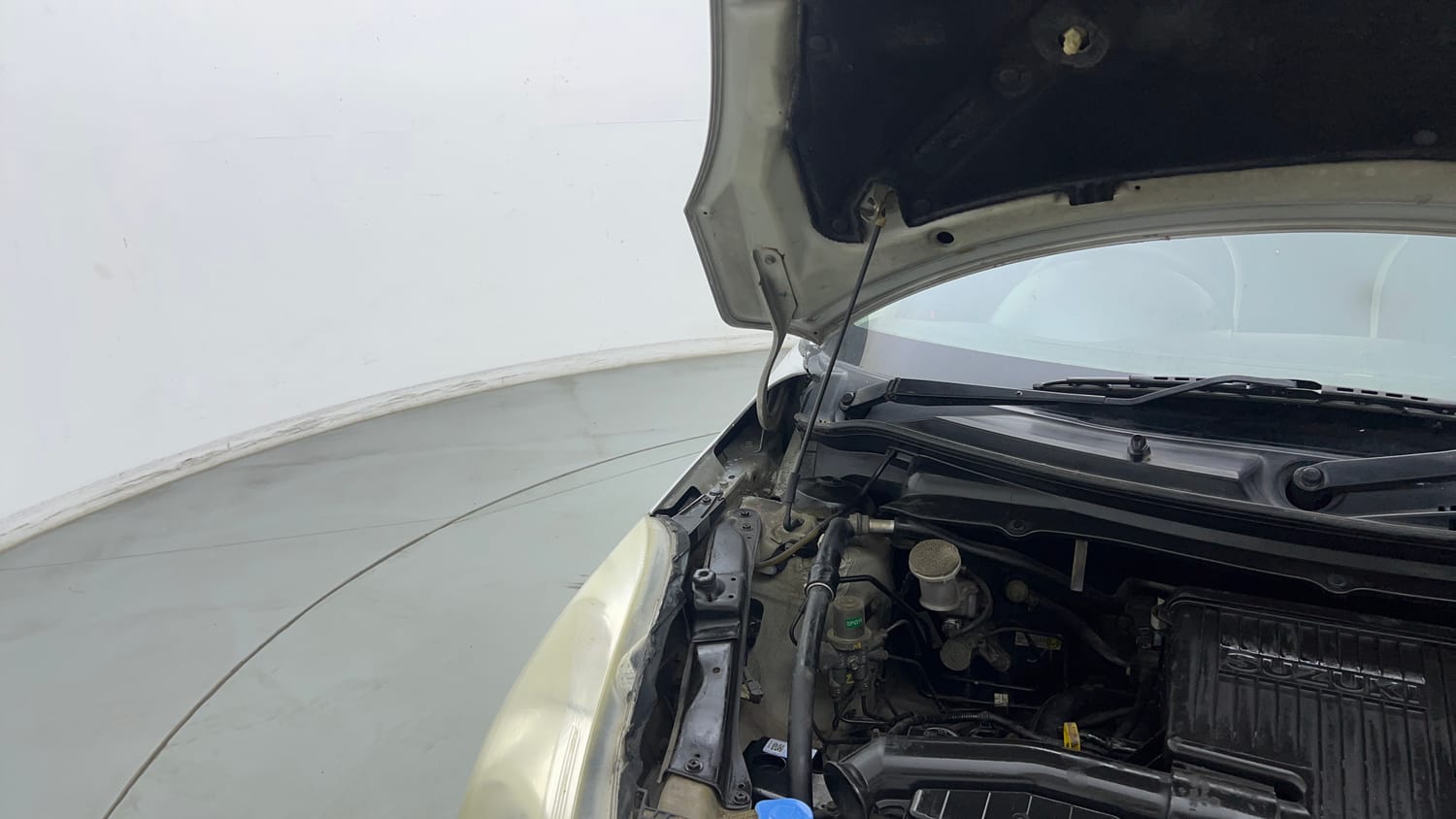 Used 2015 Maruti Suzuki Swift Lxi (O) Petrol Manual engine ENGINE RIGHT SIDE HINGE & APRON VIEW