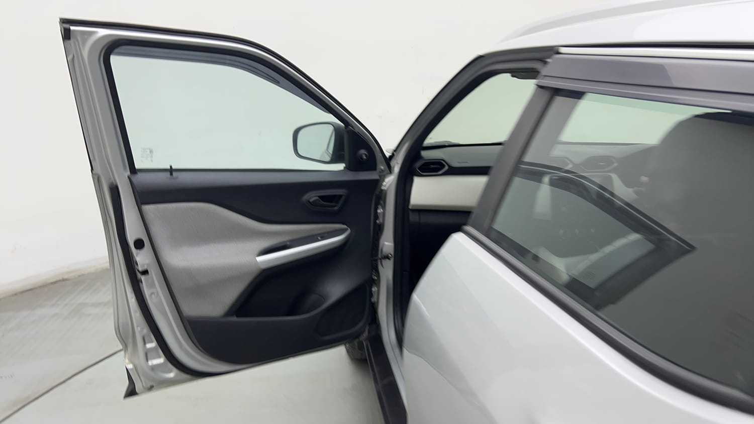 Used 2022 Nissan Magnite XE Petrol Manual interior LEFT FRONT DOOR OPEN VIEW