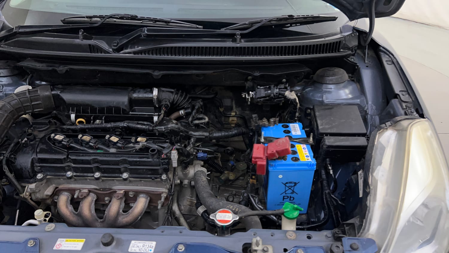 Used 2017 Maruti Suzuki Baleno Zeta 1.2 Petrol Manual engine ENGINE LEFT SIDE HINGE & APRON VIEW