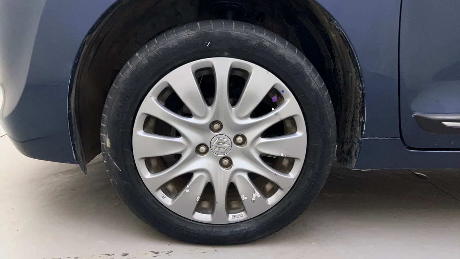 Used 2017 Maruti Suzuki Baleno Zeta 1.2 Petrol Manual tyres LEFT FRONT TYRE RIM VIEW