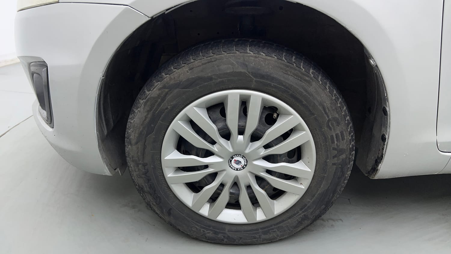 Used 2015 Maruti Suzuki Swift Lxi (O) Petrol Manual tyres LEFT FRONT TYRE RIM VIEW