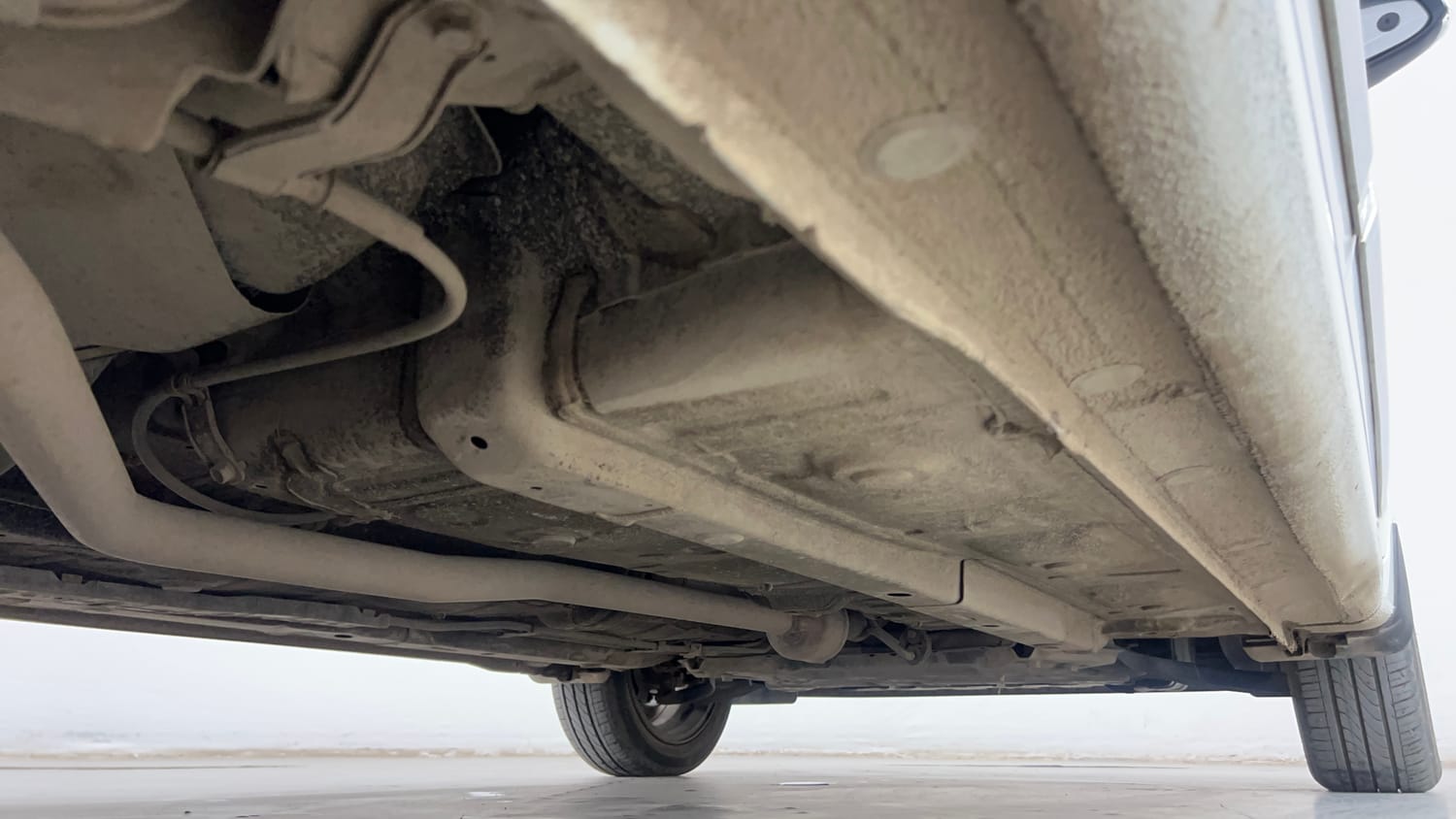 Used 2022 Hyundai Aura SX 1.2 Petrol Petrol Manual extra REAR RIGHT UNDERBODY VIEW