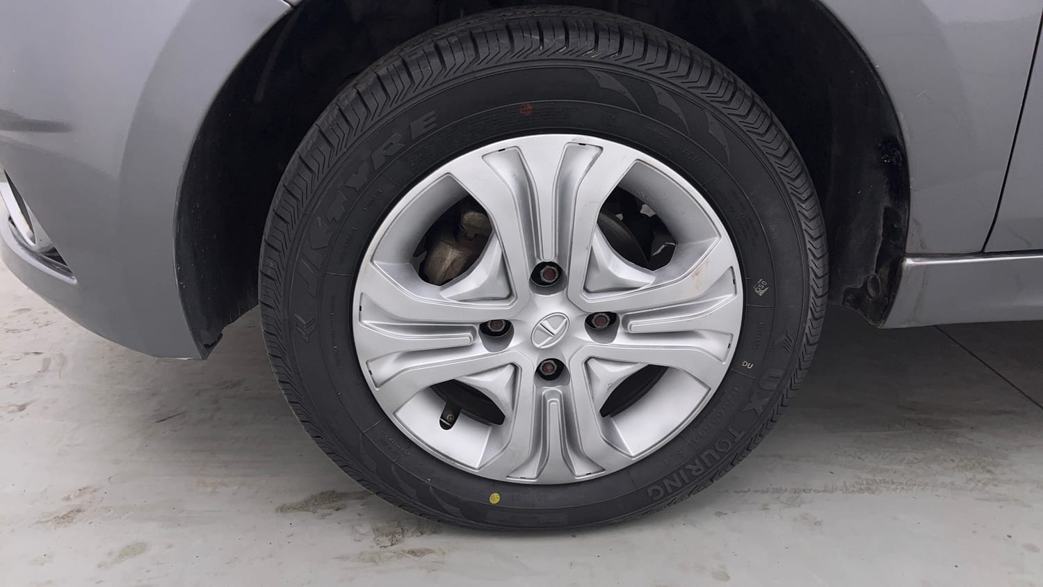 Used 2019 Tata Tiago Revotron XZ Petrol Manual tyres LEFT FRONT TYRE RIM VIEW